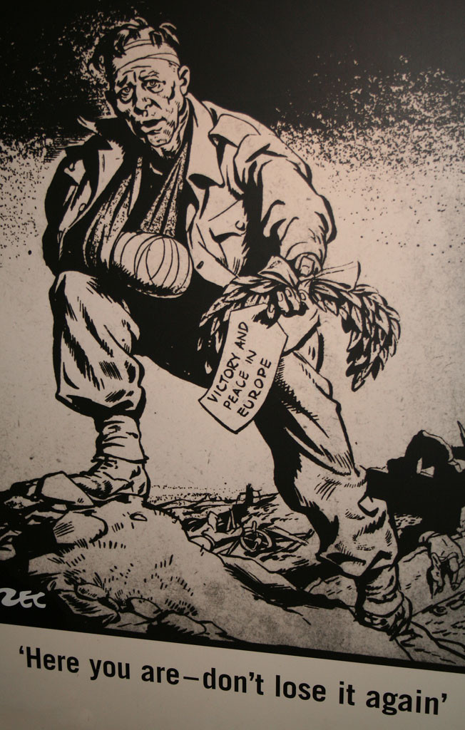 Philip Zec's VE Day cartoon (Daily Mirror, 1945): a wounded soldier holds out a laurel wreath labelled 'Victory and Peace in Europe' — 'Here you are — don't lose it again'